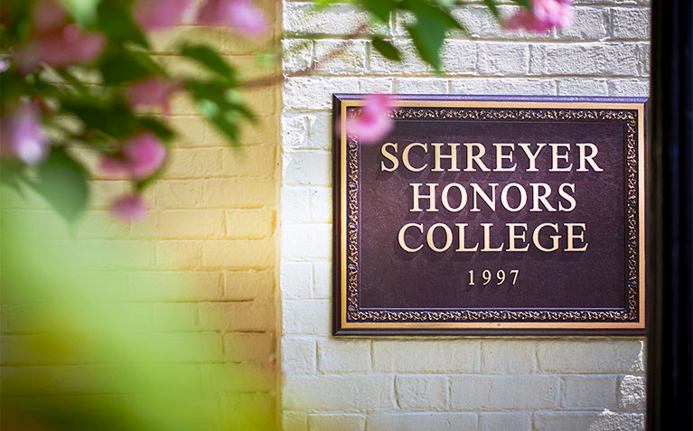 Schreyer Honors College sign in the Atherton Hall courtyard